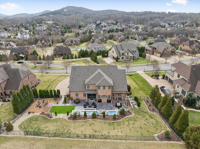 drone / aerial view with a residential view and a mountain view