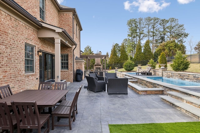 view of patio featuring a fenced in pool, outdoor dining area, and a pergola