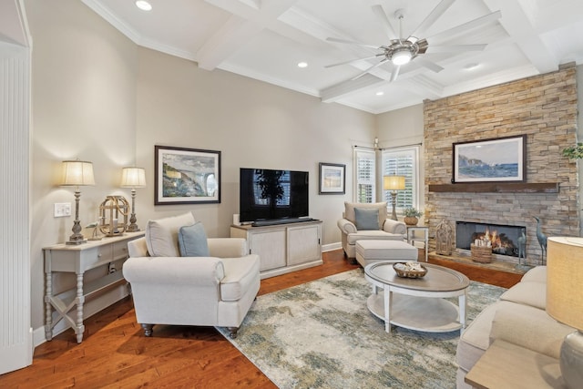 living area with coffered ceiling, beamed ceiling, baseboards, and wood finished floors