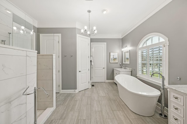 full bathroom featuring a freestanding tub, vanity, baseboards, a shower stall, and crown molding