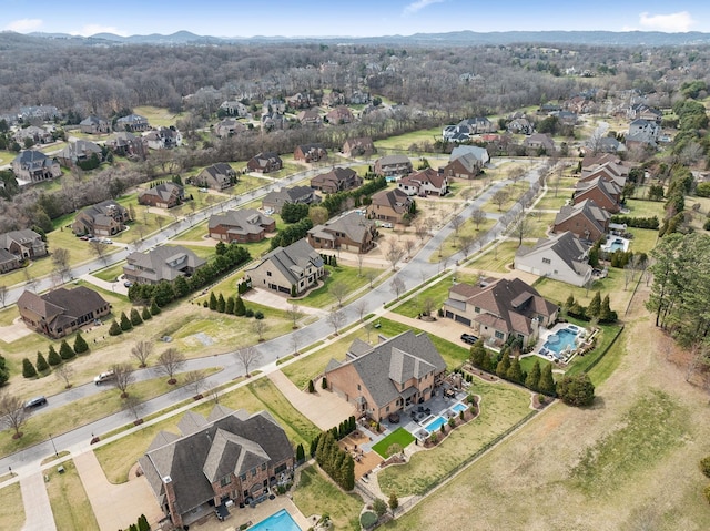 birds eye view of property with a residential view