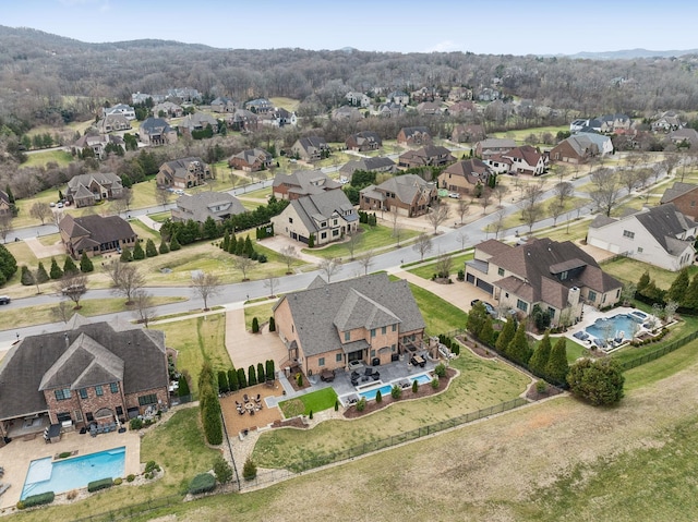 birds eye view of property with a residential view