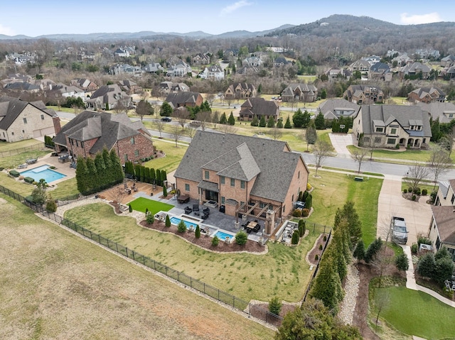 bird's eye view featuring a residential view and a mountain view