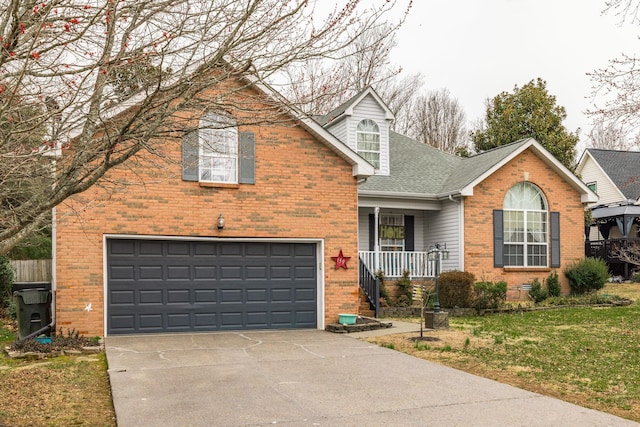 traditional-style home with covered porch, brick siding, driveway, and an attached garage