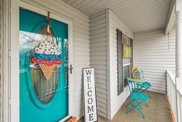 property entrance featuring covered porch