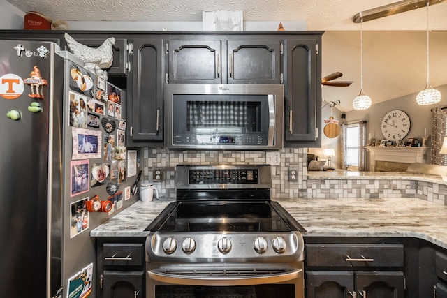 kitchen with stainless steel appliances, light stone counters, backsplash, and a textured ceiling