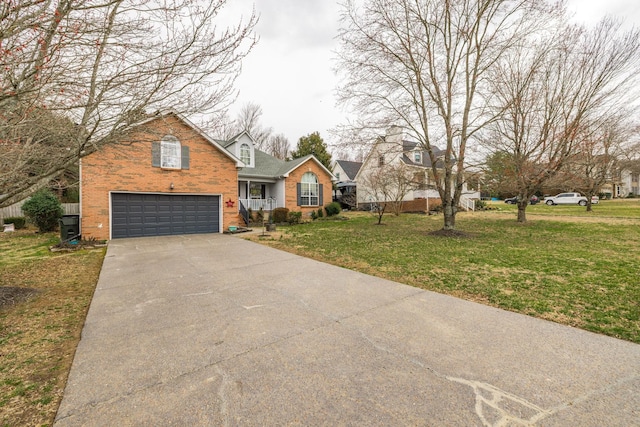 view of front of property featuring a garage, a front lawn, concrete driveway, and brick siding