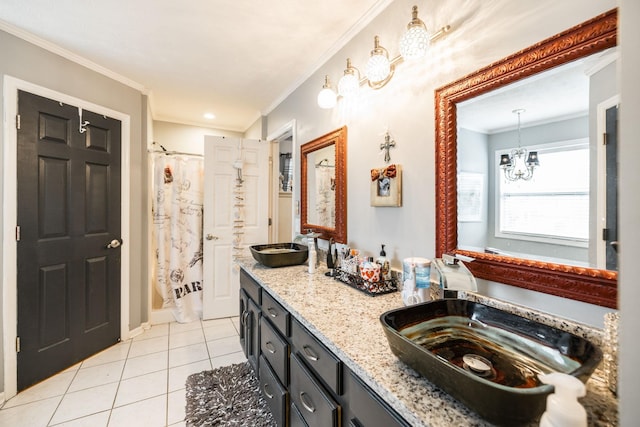 bathroom with a sink, a notable chandelier, tile patterned flooring, and crown molding