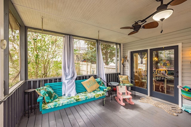 sunroom featuring ceiling fan