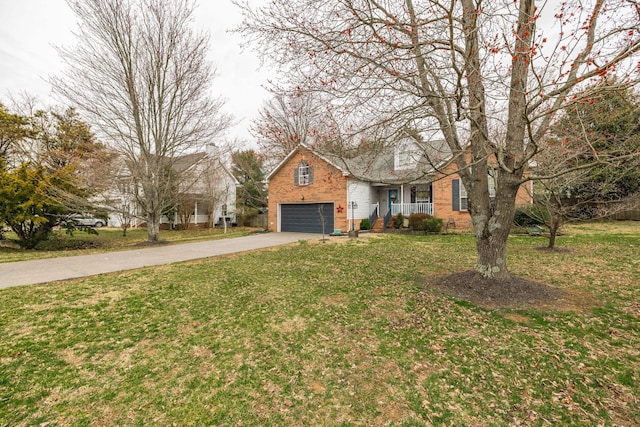 view of front of home with a porch, a front yard, concrete driveway, and brick siding