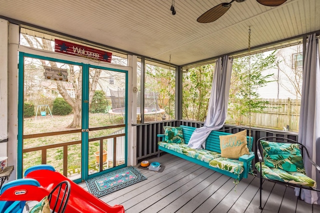 sunroom with a ceiling fan