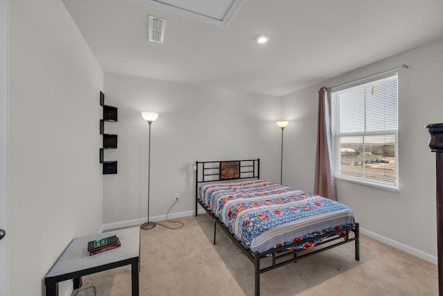 bedroom featuring carpet, visible vents, and baseboards