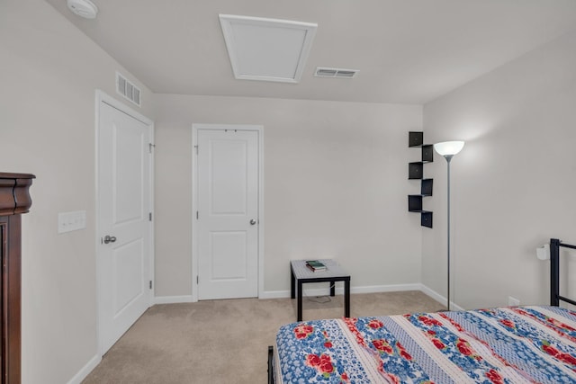 bedroom featuring carpet floors, baseboards, visible vents, and attic access