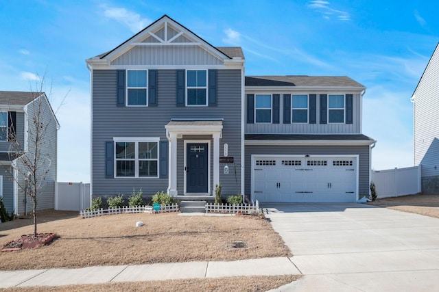 view of front facade featuring driveway, a garage, fence, and board and batten siding