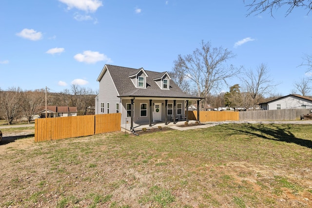 back of house with a patio, roof with shingles, a yard, and fence