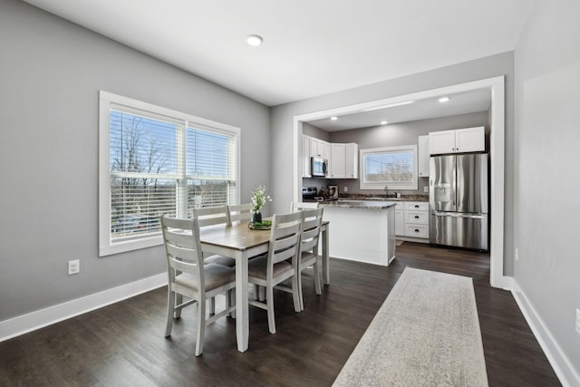 dining room featuring recessed lighting, baseboards, and dark wood-style flooring