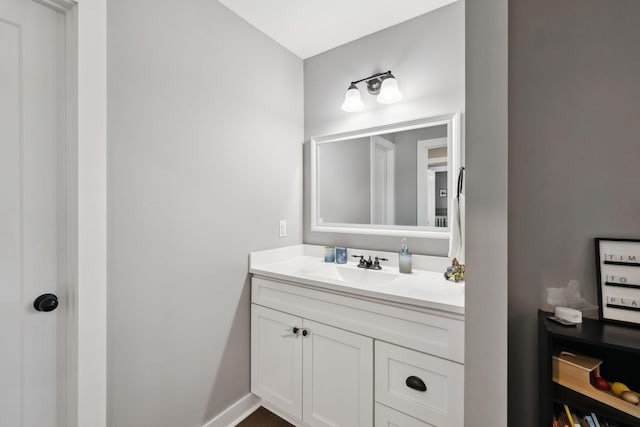 bathroom featuring vanity and baseboards