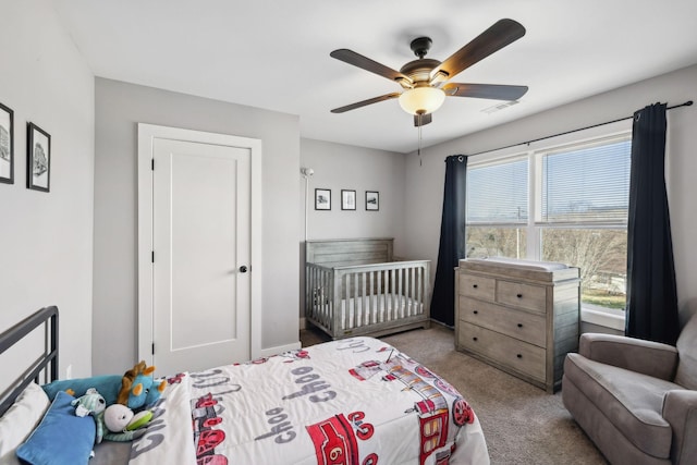 bedroom featuring visible vents, carpet flooring, and a ceiling fan