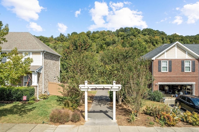 view of front of property featuring fence