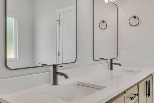 bathroom featuring double vanity and a sink