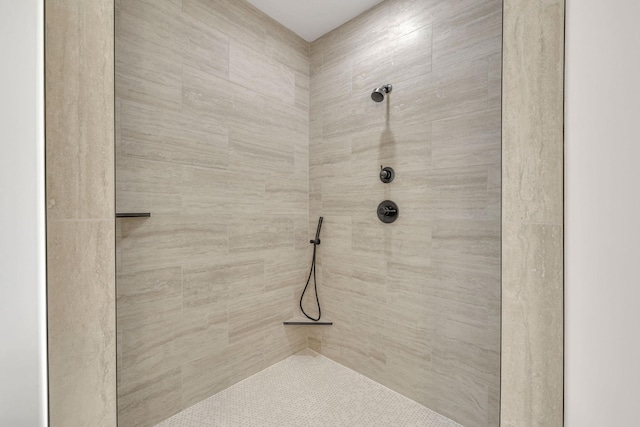 bathroom with tiled shower