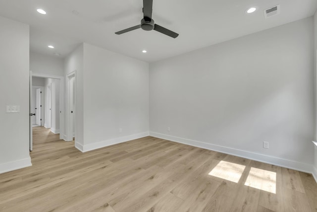 unfurnished room with light wood finished floors, baseboards, visible vents, ceiling fan, and recessed lighting