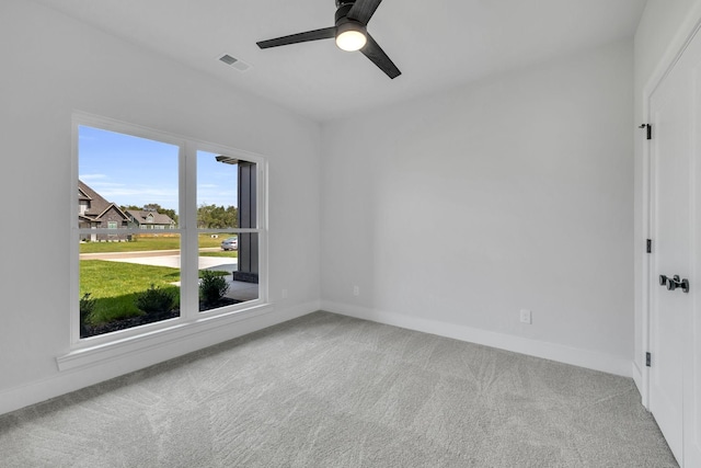 unfurnished room with carpet floors and baseboards