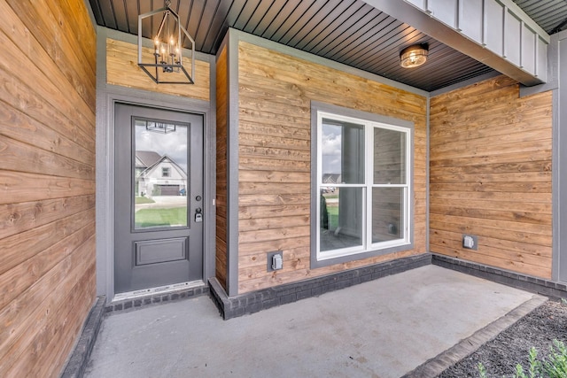 property entrance with board and batten siding