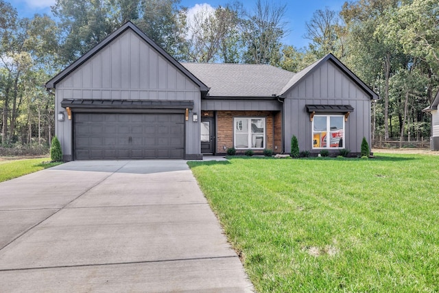 modern inspired farmhouse featuring a garage, concrete driveway, board and batten siding, and a front yard