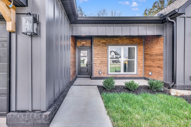 entrance to property featuring board and batten siding and a porch