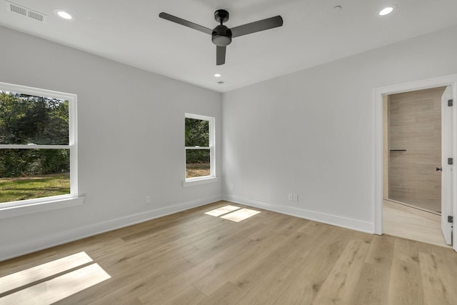 unfurnished bedroom featuring light wood finished floors, baseboards, visible vents, and recessed lighting