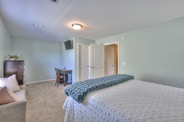 carpeted bedroom featuring visible vents, baseboards, and a closet