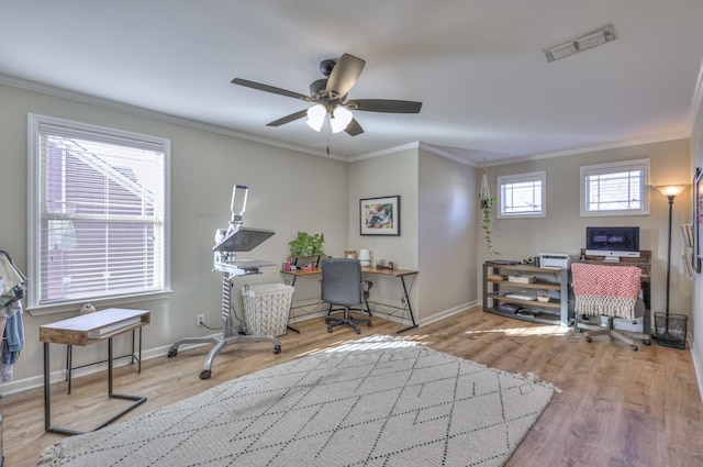 home office featuring visible vents, baseboards, ceiling fan, ornamental molding, and wood finished floors