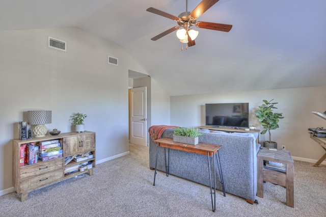 carpeted living area with vaulted ceiling, baseboards, visible vents, and ceiling fan