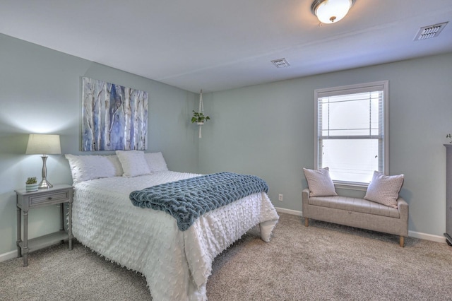 bedroom with carpet flooring, baseboards, and visible vents