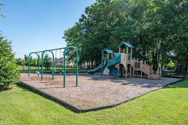 communal playground with a lawn