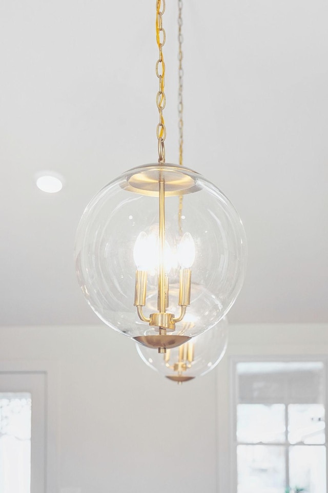 interior details featuring a notable chandelier