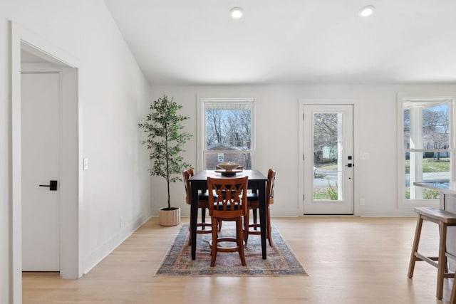 dining area with light wood-style floors, baseboards, and recessed lighting