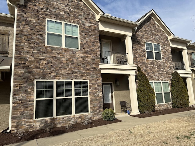 exterior space with stone siding