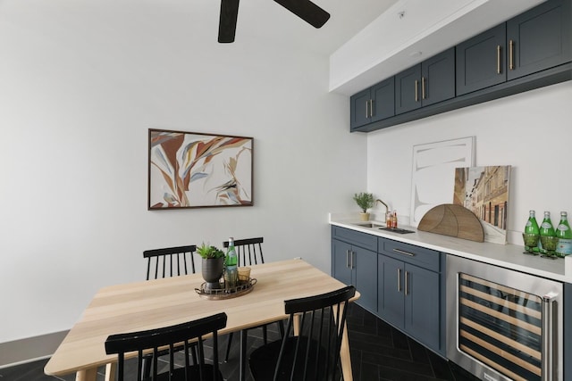 dining area with wine cooler and ceiling fan