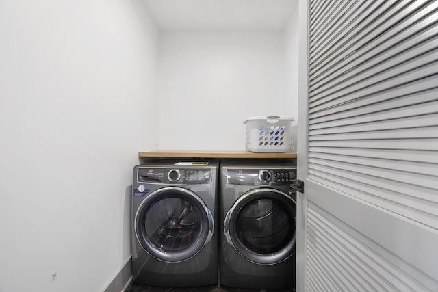 laundry area with laundry area and separate washer and dryer