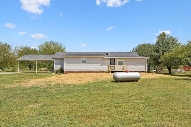 rear view of property with a yard