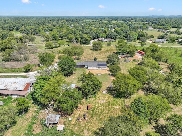 aerial view featuring a wooded view