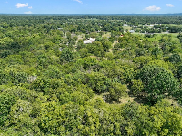 bird's eye view featuring a view of trees