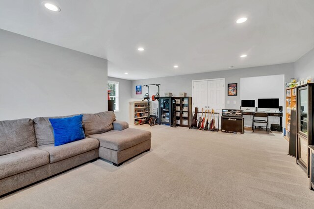 living room with recessed lighting and light colored carpet