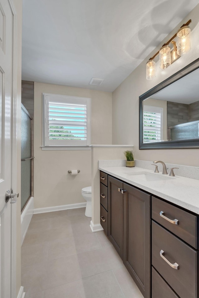 bathroom with visible vents, baseboards, toilet, tile patterned flooring, and vanity