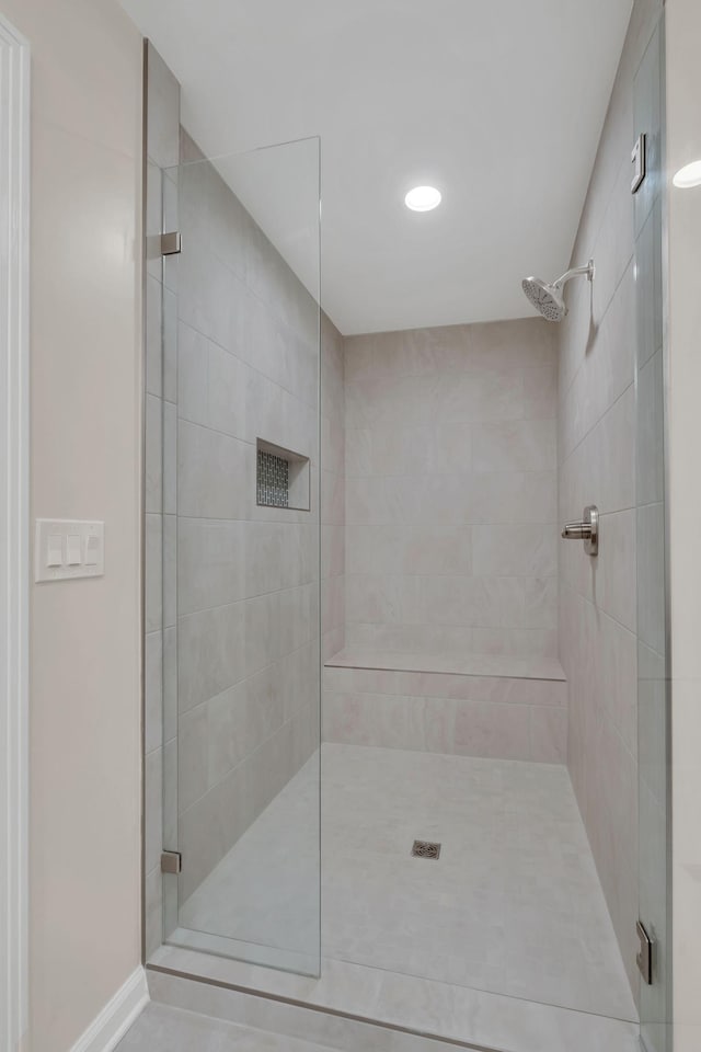 bathroom featuring tiled shower