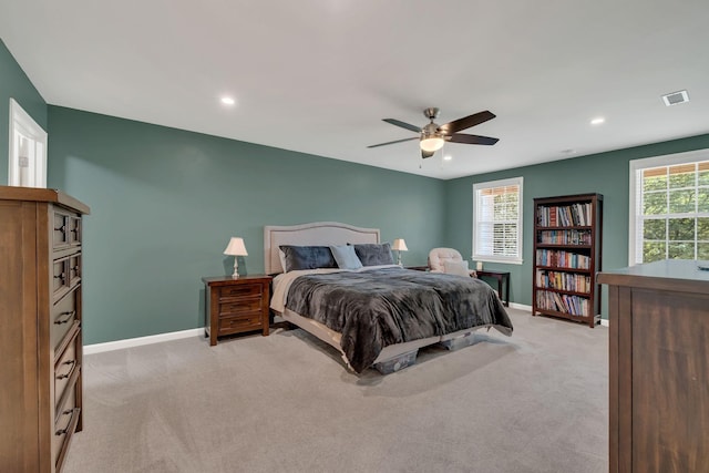 bedroom with ceiling fan, recessed lighting, light colored carpet, visible vents, and baseboards