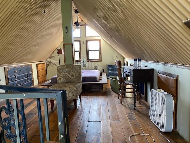 interior space with vaulted ceiling and hardwood / wood-style flooring