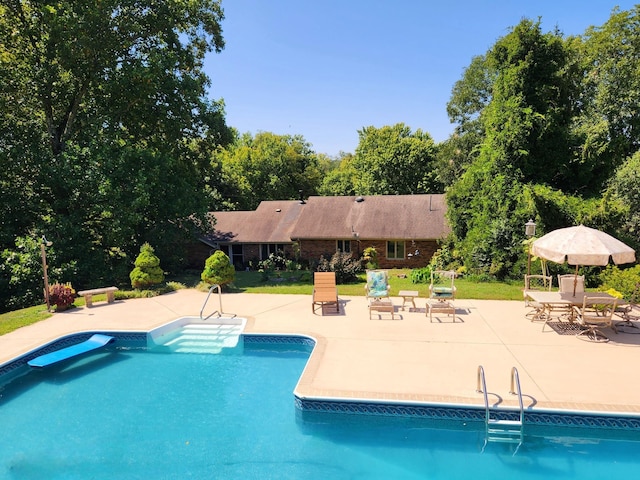 outdoor pool with a patio